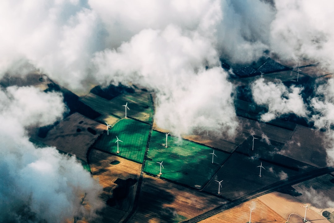 aerial-photo-of-wind-turbines-near-field-b09tl5bsqjk